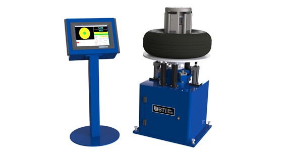 Static Tire Balancer with Pneumatic Paddle Style Tooling and Load Assist Elevator